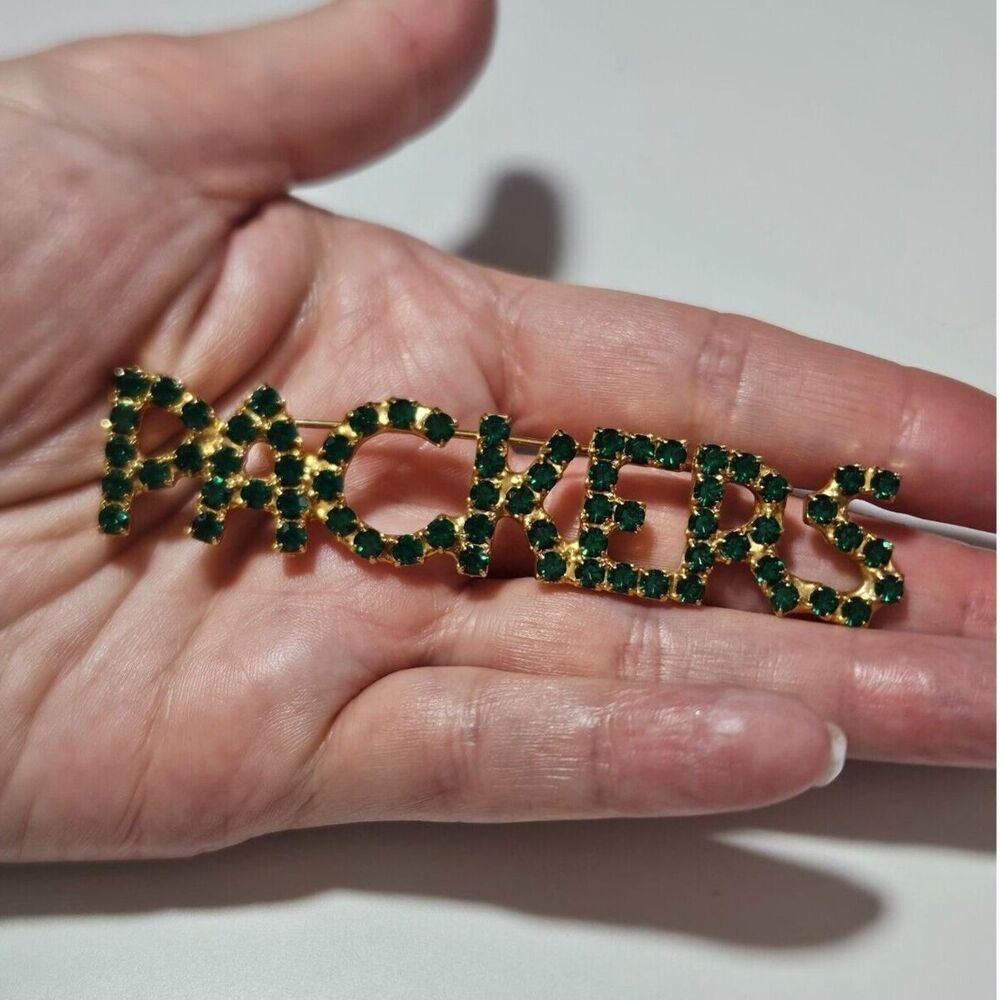 Gold tone and green rhinestone bling packers pin brooch